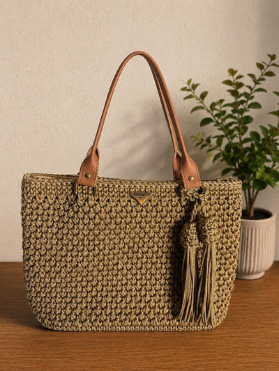 Taupe crochet tote bag with tassels, leather base and strap