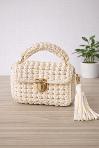 Off white crochet hand bag with tassels and shoulder strap