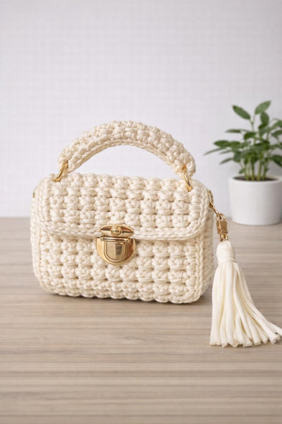 Off white crochet hand bag with tassels and shoulder strap
